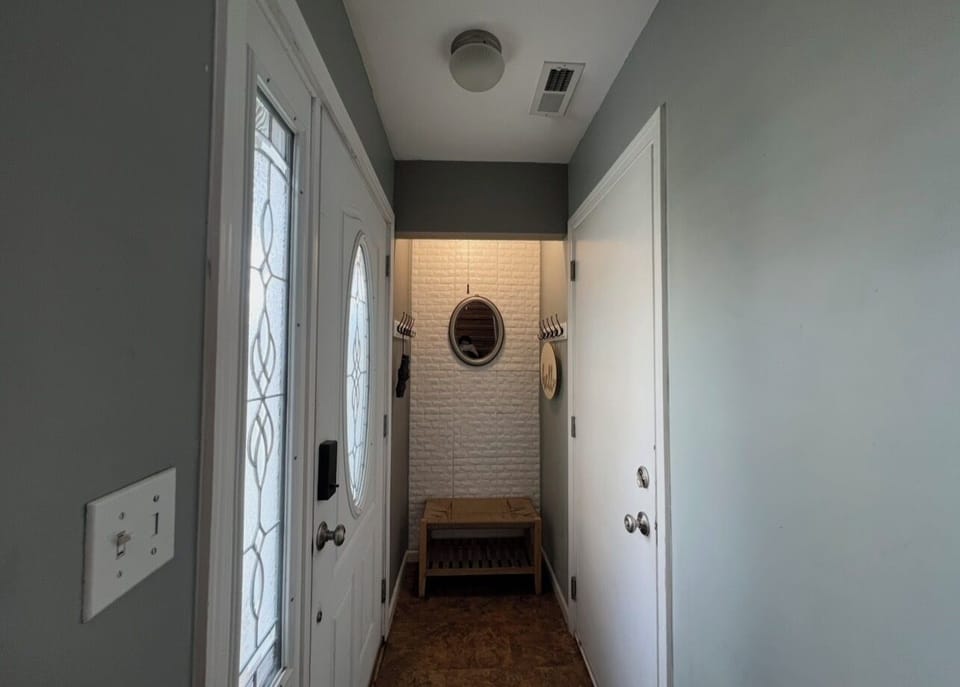 Interior front door entrance and garage door.