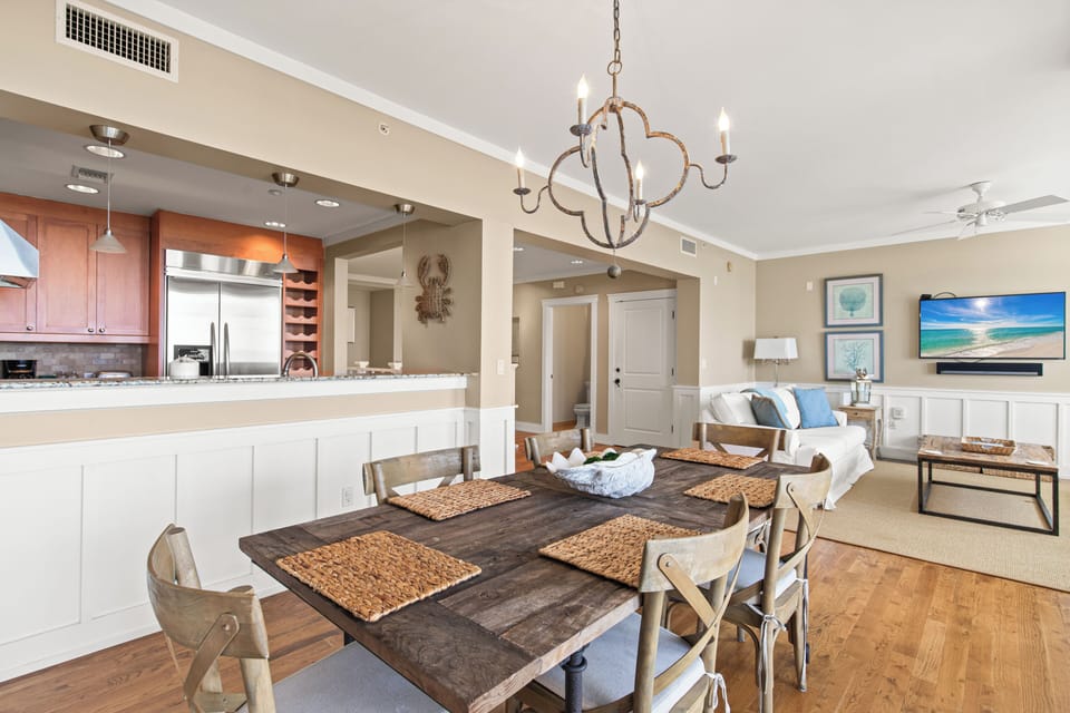 Gather around your elegant dining table while the chef in your group prepares meals in the open kitchen—perfect for memorable vacation dinners together.