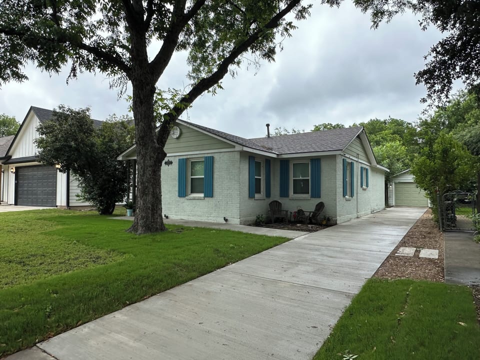 Extra long driveway provides ample private parking for multiple vehicles.