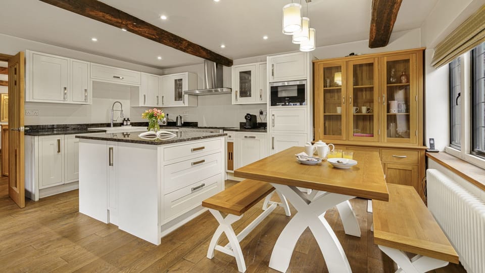In the kitchen, sit for breakfast in the morning light.