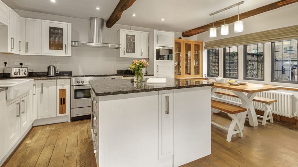 The kitchen is fully equipped with everything needed for dining and entertaining, with an American-style fridge freezer, 13-place dishwasher, coffee machine, Bibo water system, kettle and toaster.