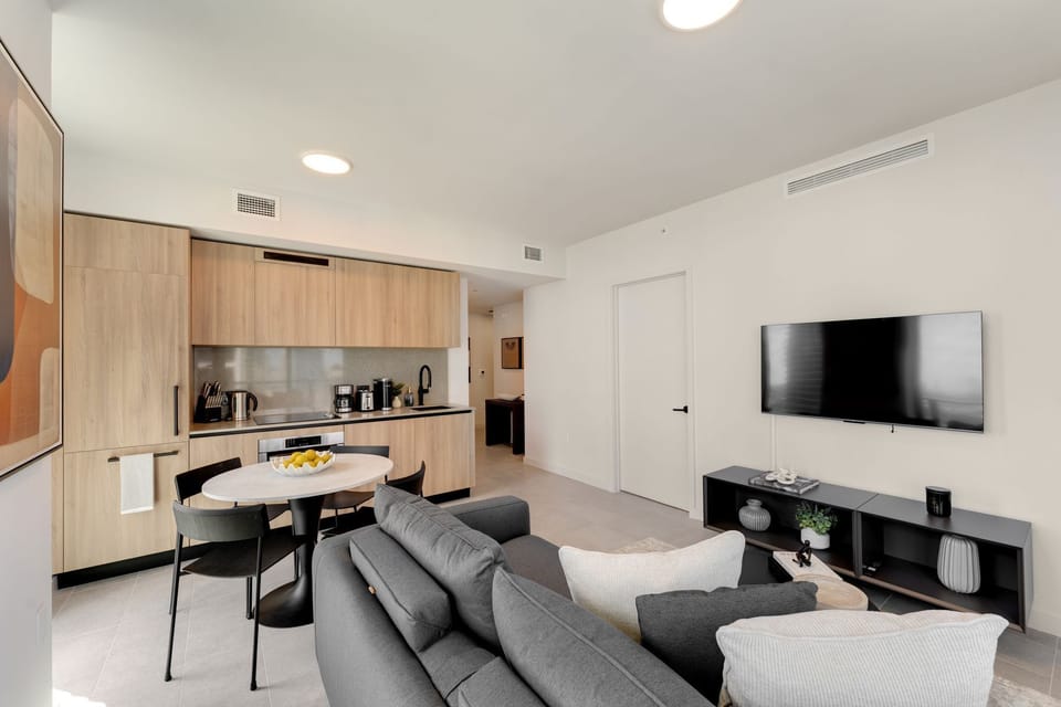 Comfortable lounge area with smart TV and dining space