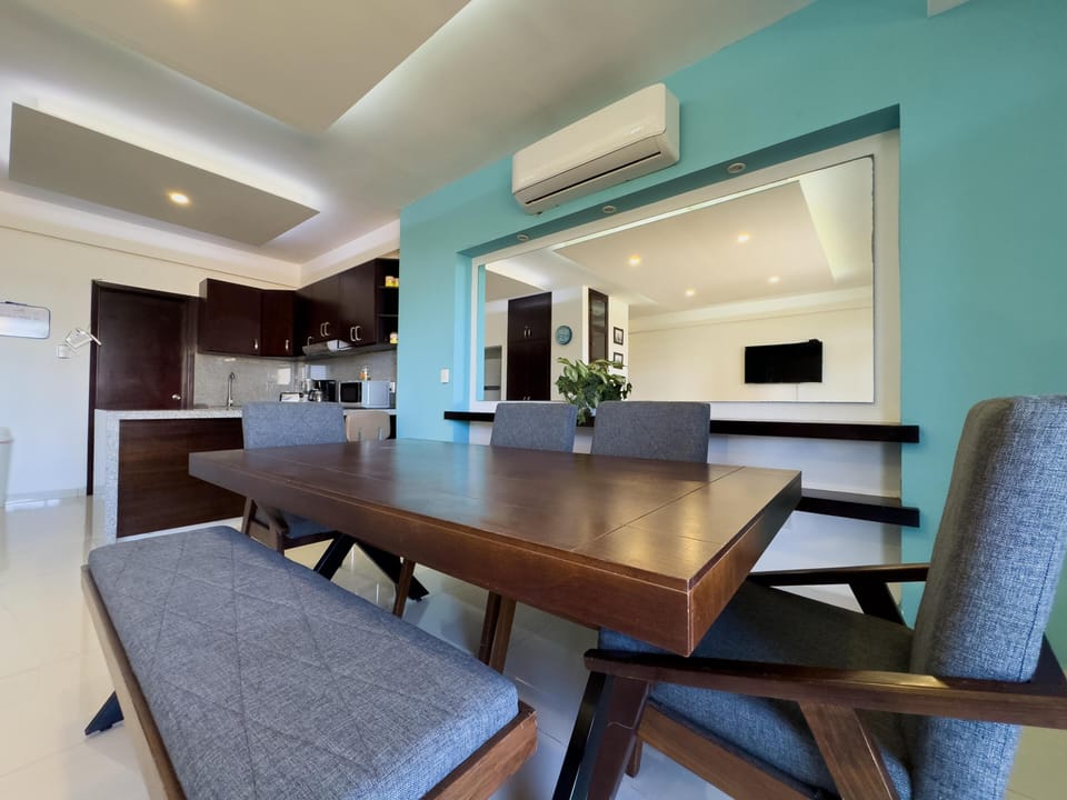 Bright dining area with modern kitchen and cozy seating