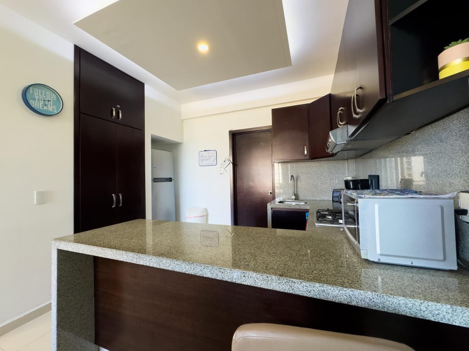 Modern kitchen with sleek granite countertops and ample storage