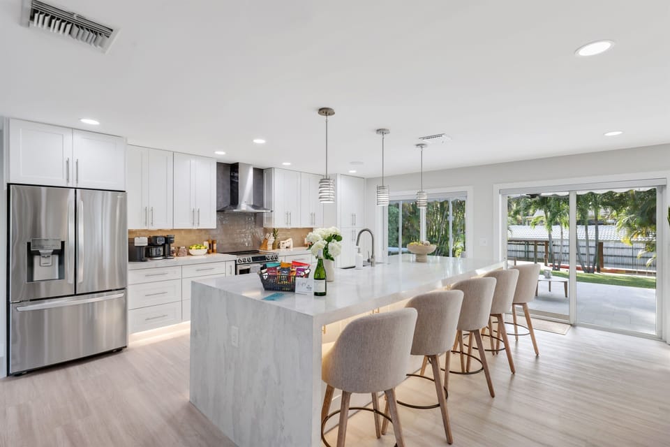 Cook meals, gather around the island and enjoy a bright open space that connects to the outdoor area.