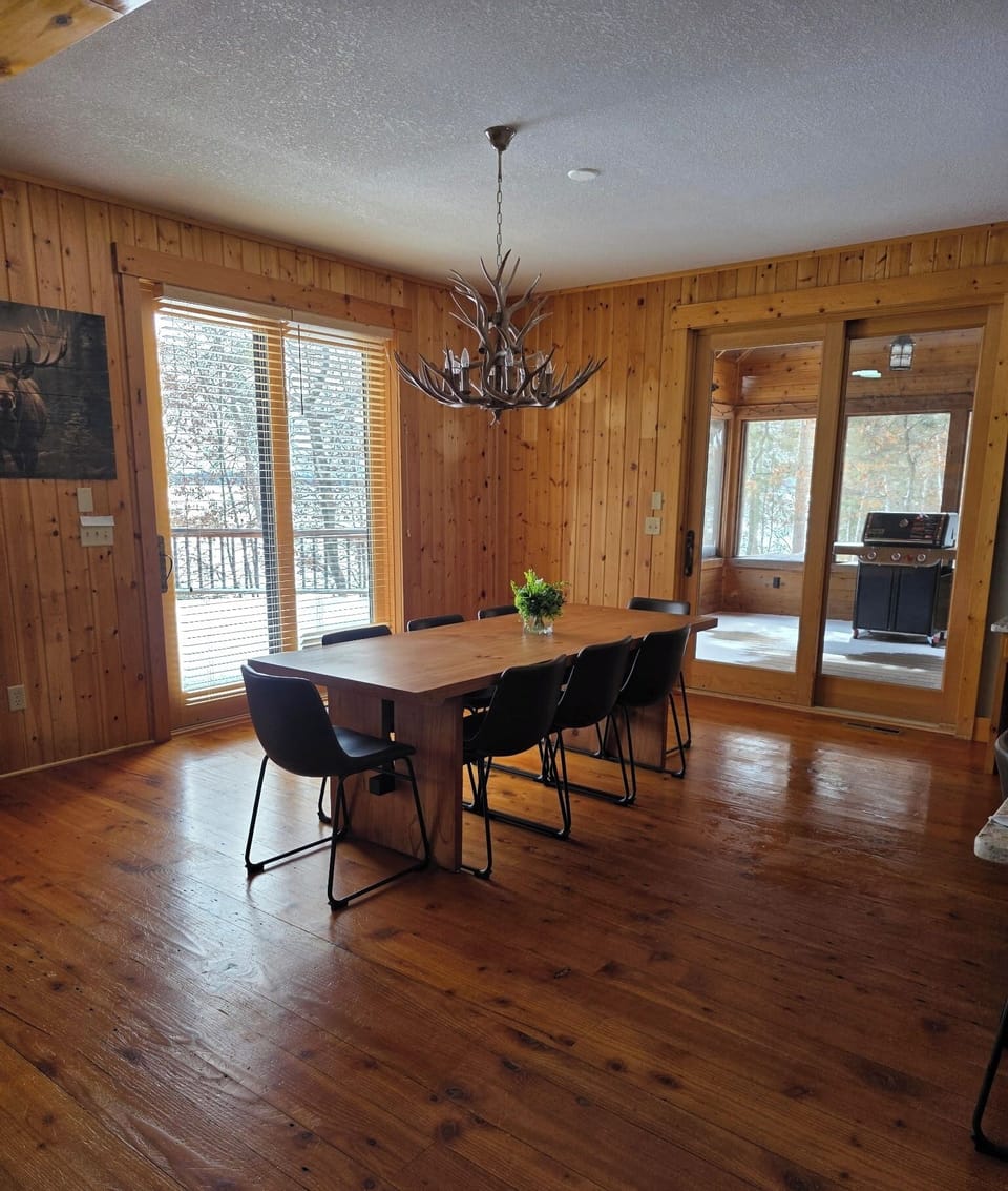 Large master bedroom with direct access to the deck and lake.