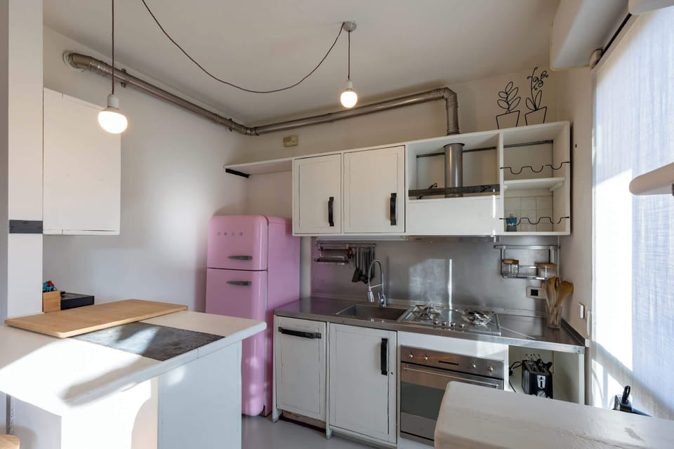 Fully equipped kitchen with modern appliances and dining space

