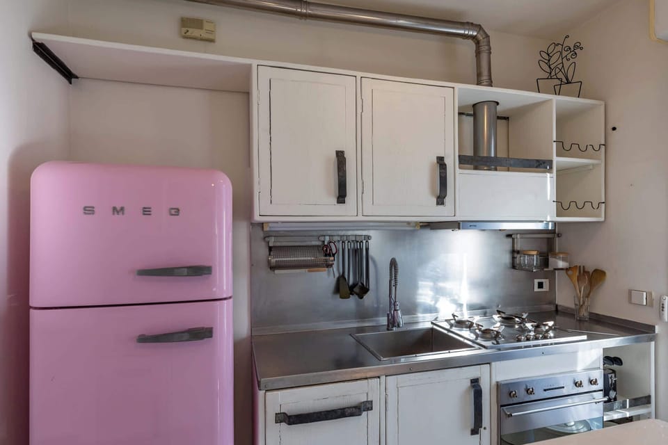 Fully equipped kitchen with unique retro-style fridge