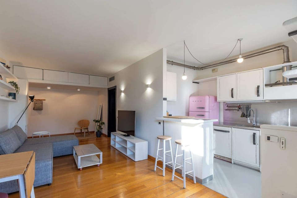 Stylish open space combining kitchen, dining, and lounge area