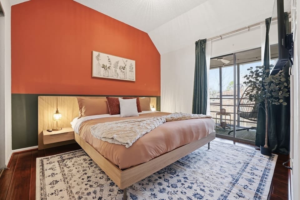 Bedroom with King Bed, 43" TV, closet and Balcony access