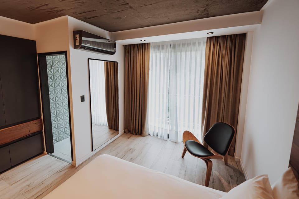 Sip coffee by the window in a calm, airy corner.