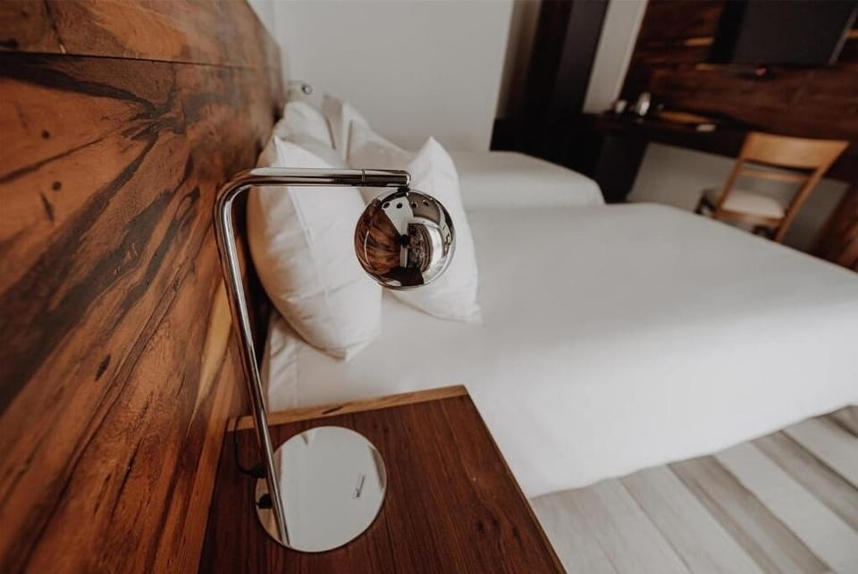 Enjoy bedtime reading with sleek, adjustable bedside lighting.