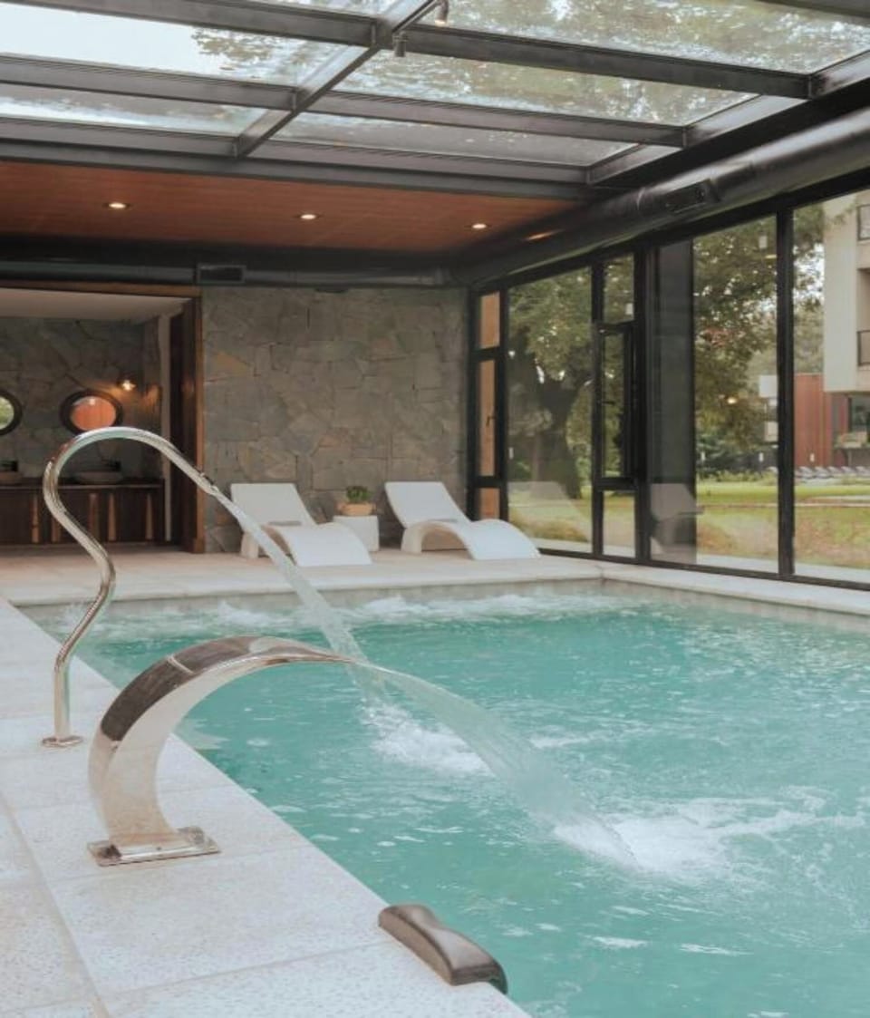 Relax to the soothing splash of the pool’s water feature.