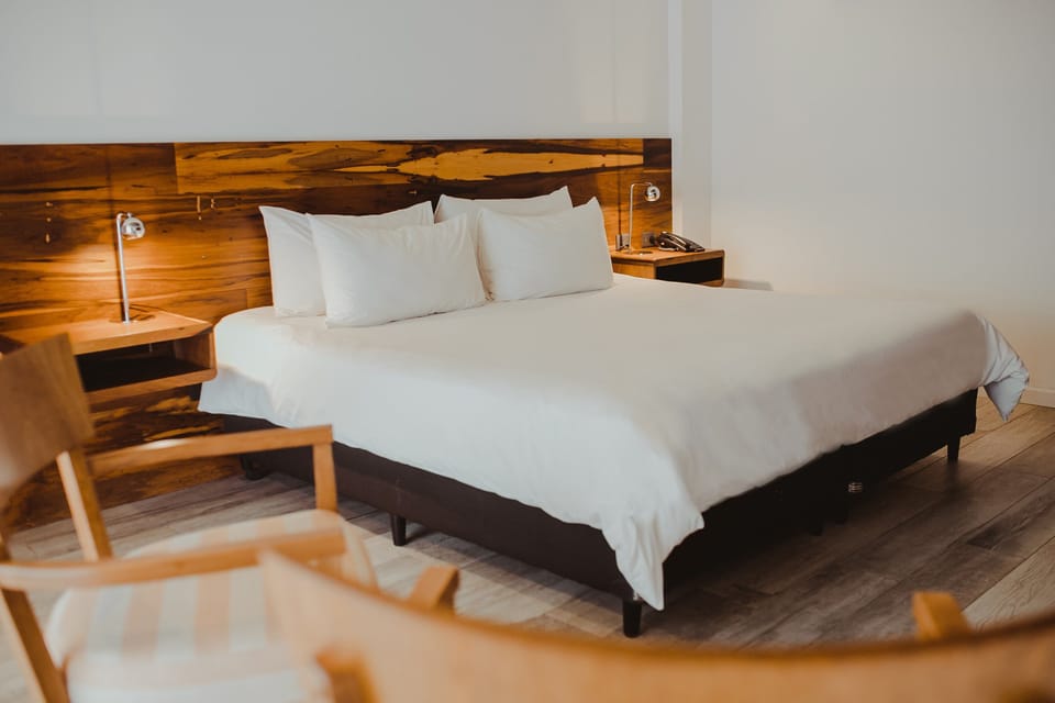 Relax into serene simplicity with hotel-style bedding and glow.