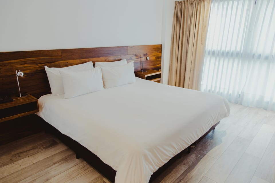 Wake gently to soft daylight spilling across warm wood tones.