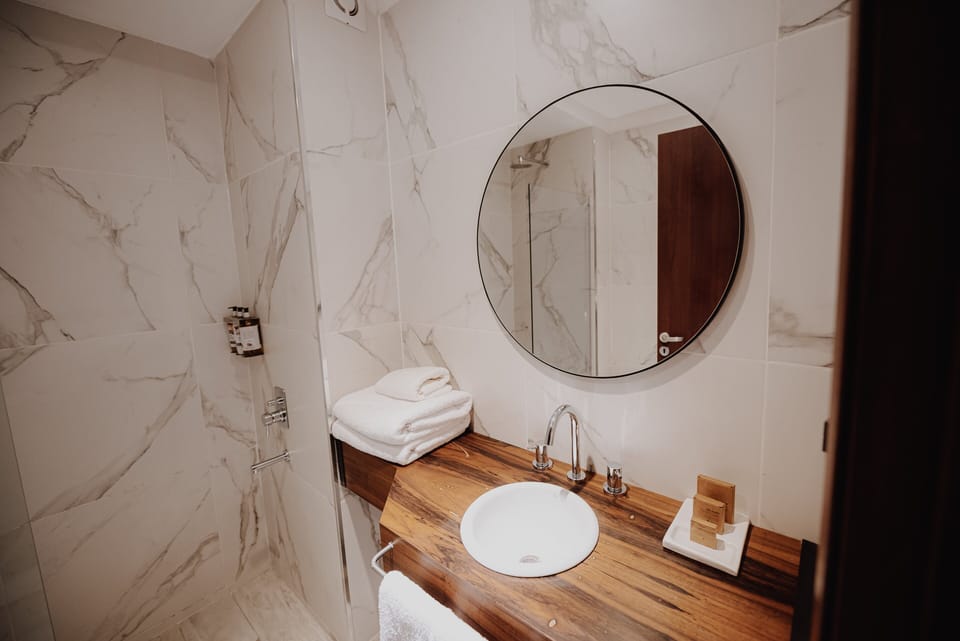 Start the day at a bright vanity with fresh towels.