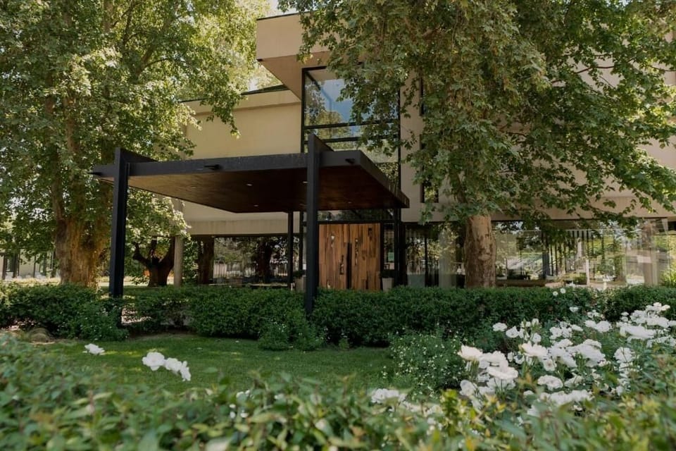 Wander through lush gardens toward a beautifully modern hideaway.