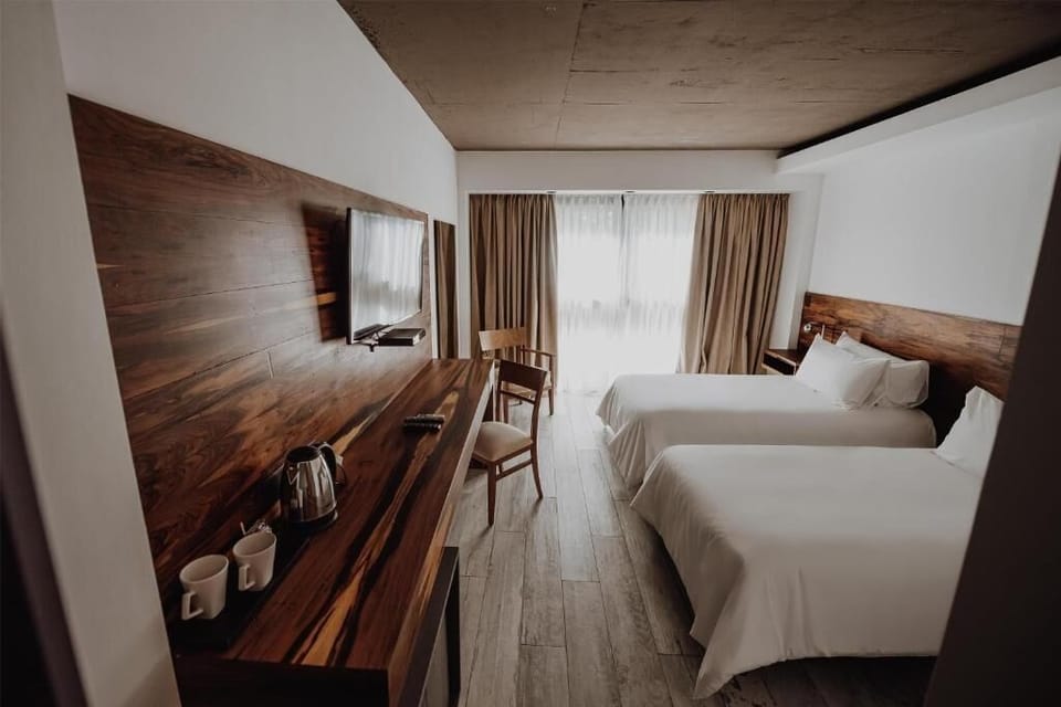 Settle in with a roomy layout, desk, and TV.