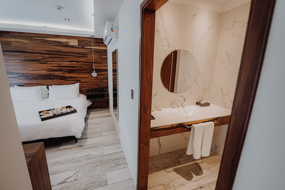 Refresh effortlessly with sleek vanity just steps from bed.