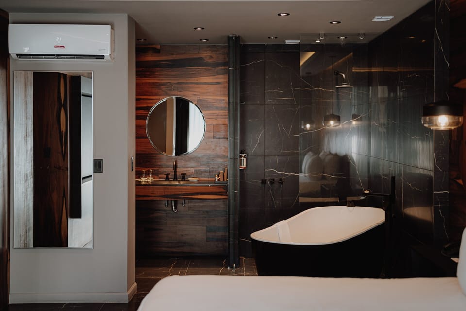 Refresh with a rainfall shower and elegant vanity details.
