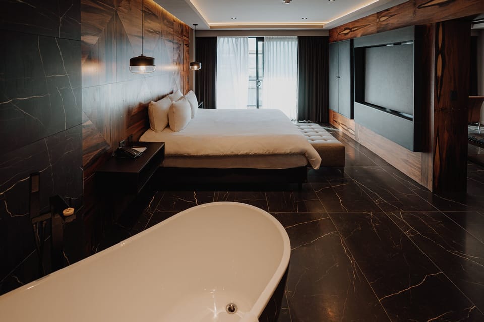 Soak and slow down in your private tub-and-bed retreat.