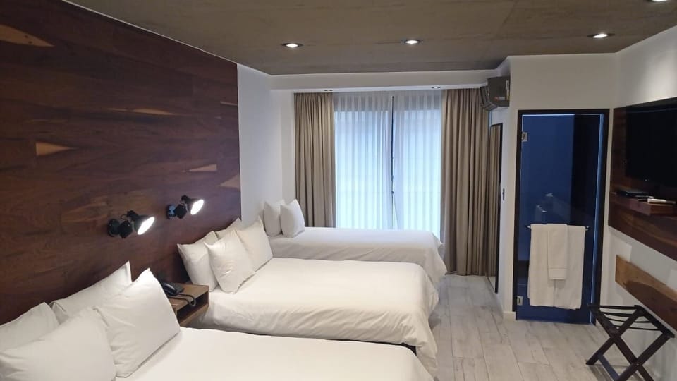 Stretch out comfortably with soft lighting and airy curtains.