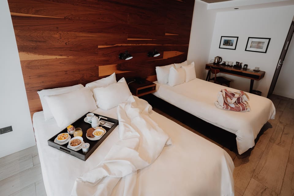 Wake slowly with crisp linens and breakfast in bed.