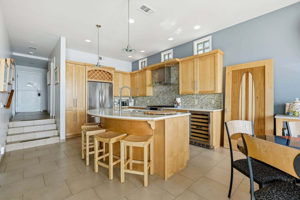 Spacious chef's kitchen with island seating and modern finishes