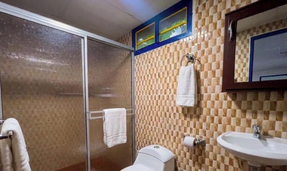 Quadruple Room | Bathroom | Shower, towels, soap, shampoo