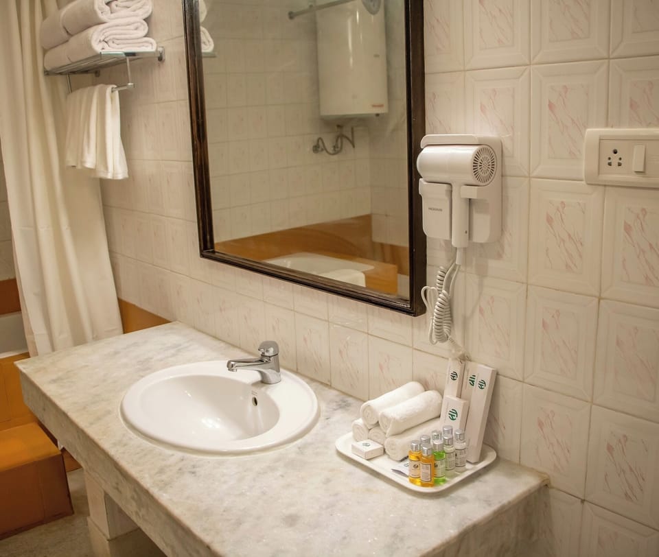 Deluxe Double Room, Balcony, River View | Bathroom | Combined shower/tub, hair dryer, slippers, towels