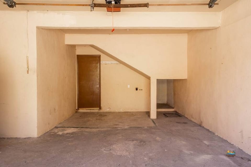 The ground-floor garage in this 2-bedroom, 2-bath beach condo offers protected off-street parking, keeping your vehicle out of the sun and sand. The secure space is conveniently located just steps from the beach and a short walk to the Malecon.