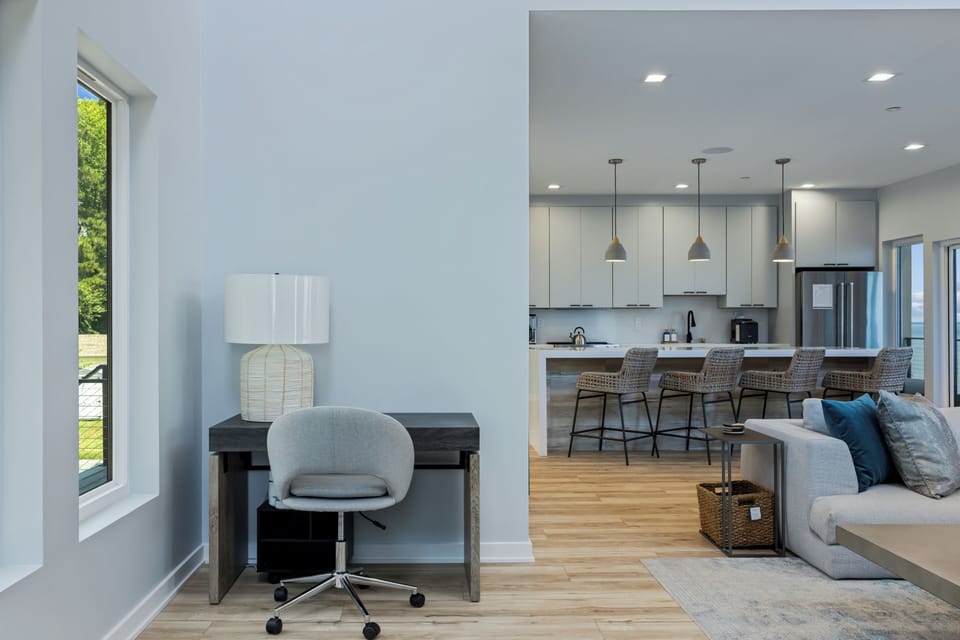 Workspace with task chair and desk lamp.