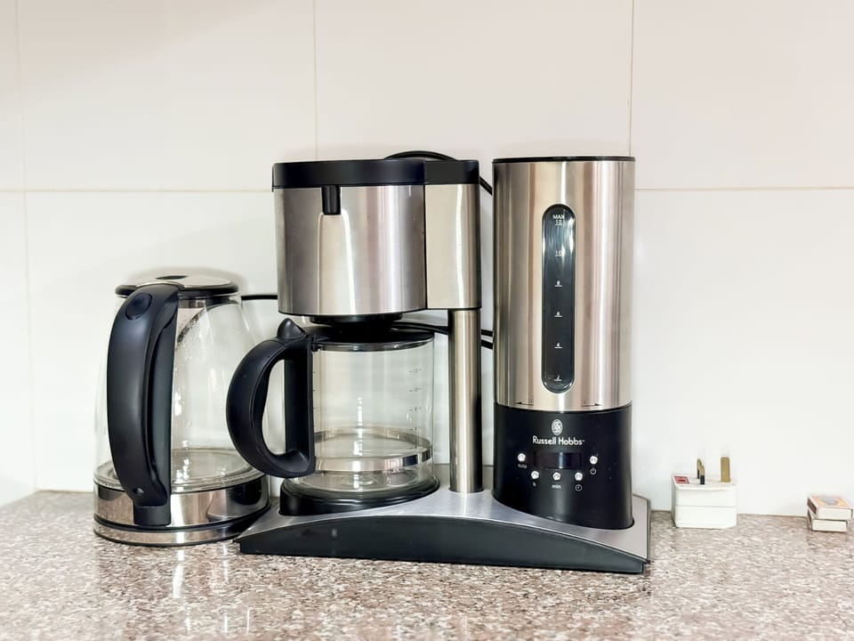 Apartment, Balcony, City View | Coffee and/or coffee maker