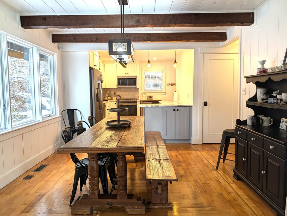 DINING ROOM (MAIN FLOOR):  Beautiful dining room with custom-made dining table that seats 8 adults
