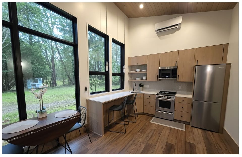 Kitchen and dining with tall windows, custom modern stocked kitchen