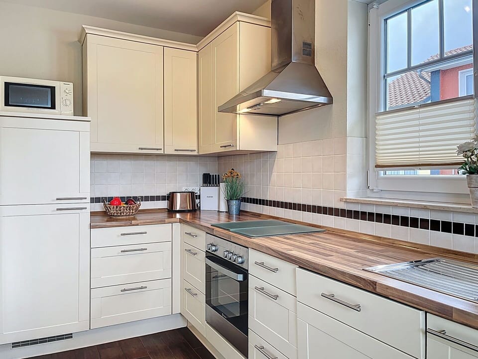 Cabinetry, Kitchen, Countertop, Kitchen Appliance, Flooring, Major Appliance, Interior Design, Wood, Home Appliance, Floor