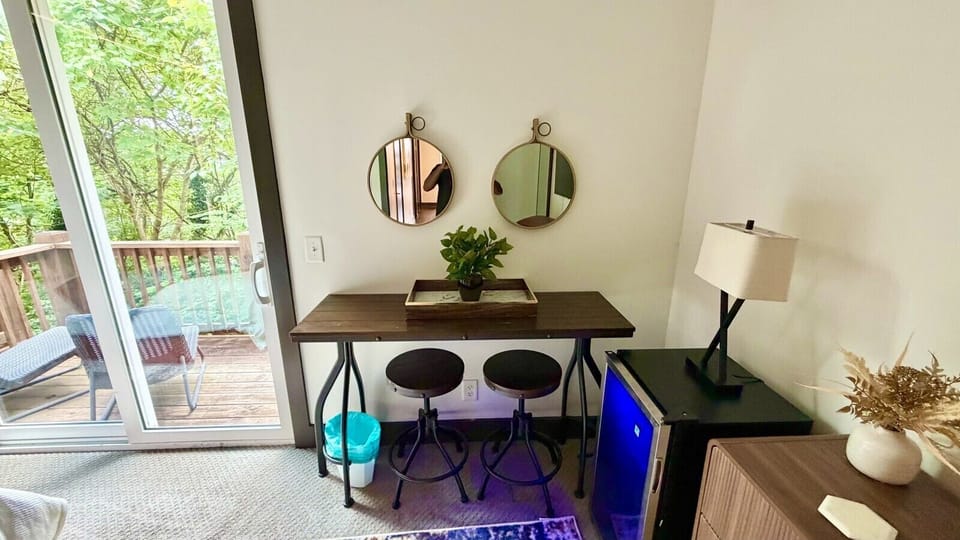 Indulge in a restful escape  within this cozily designed bedroom, boasting a pleasant king bed, a dedicated workspace with a desk, coffee bar & mini fridge, a stylish dresser, and a generous closet. Experience the perfect blend of comfort and sophisticati