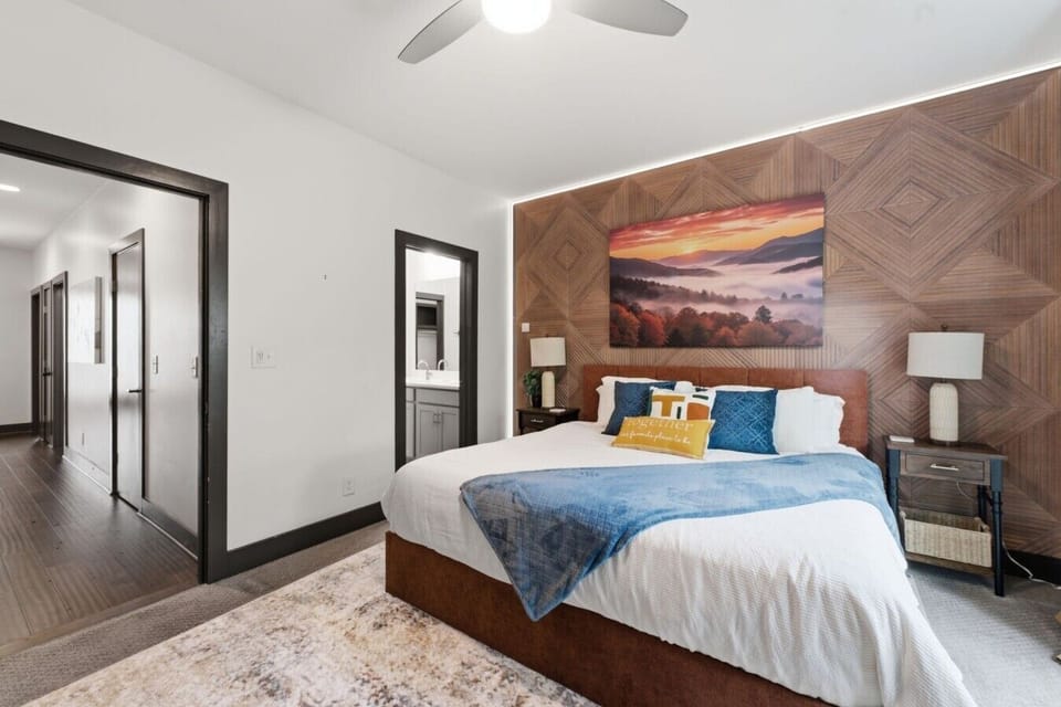 Indulge in a restful escape  within this cozily designed bedroom, boasting a pleasant king bed, a dedicated workspace with a desk, coffee bar & mini fridge, a stylish dresser, and a generous closet. Experience the perfect blend of comfort and sophisticati