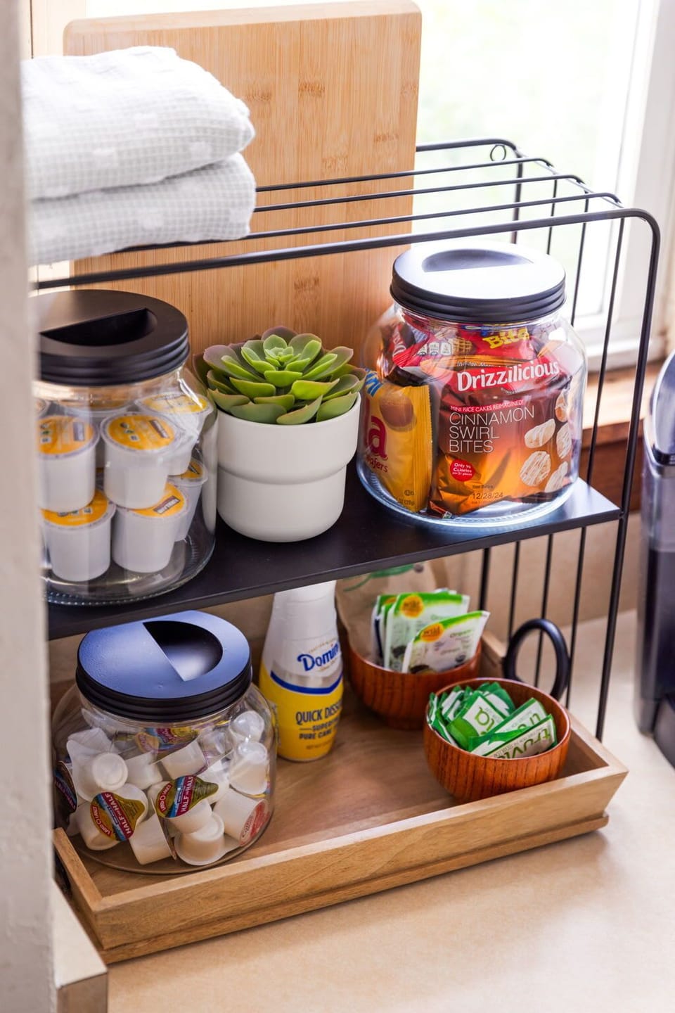Enjoy thoughtful extras with a selection of snacks and essentials neatly organized for your convenience. Perfect for quick bites or added comfort, making your stay feel even more welcoming.