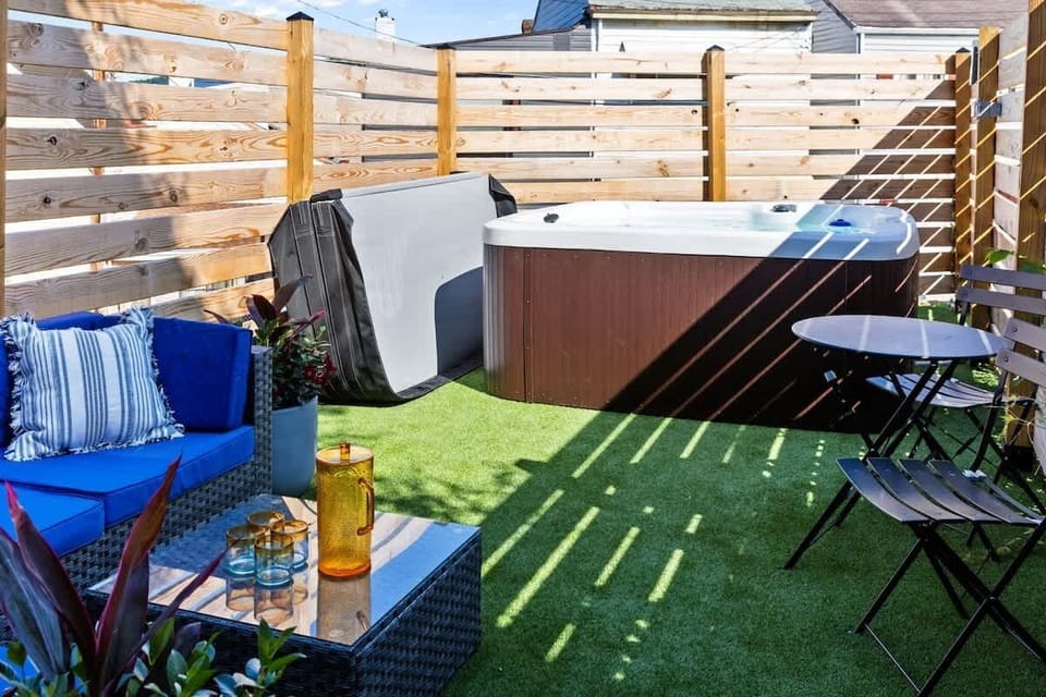 Relax in a private hot tub surrounded by a cozy outdoor setting, perfect for unwinding any time of day. Designed for comfort and privacy, it’s your own peaceful escape during your stay.