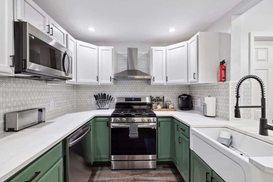 Fully equipped modern kitchen with stainless steel appliances, ample counter space, and everything you need to cook, enjoy coffee, and dine comfortably at home.