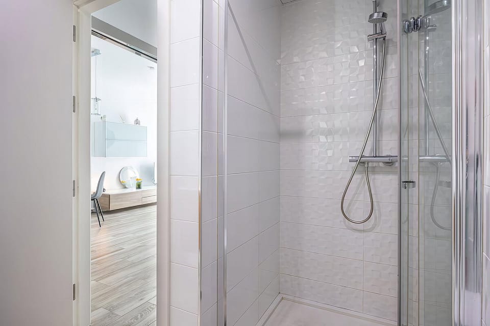 The bathroom has a shower.