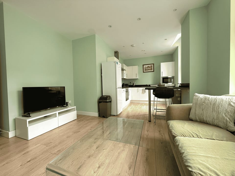 Standard Apartment | Living area | 40-inch LED TV with cable channels