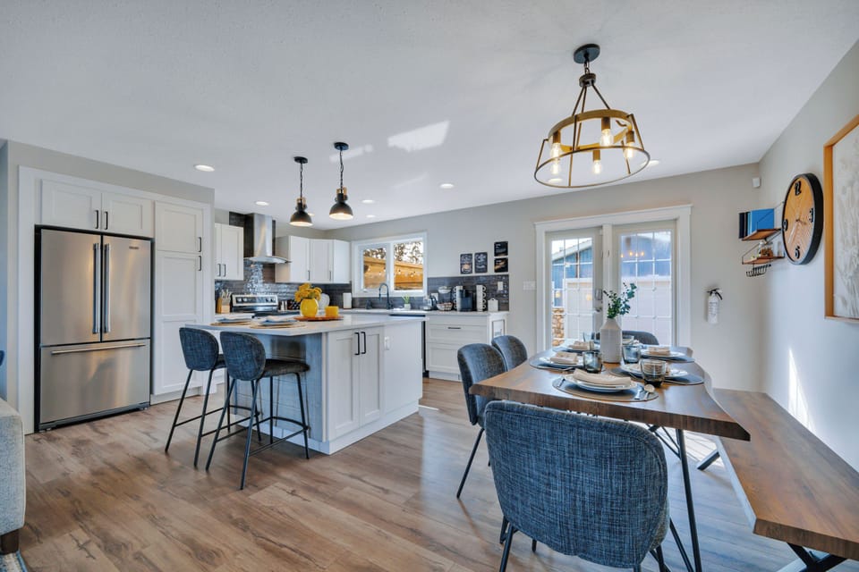 Bright open-concept kitchen and dining space, perfect for gathering together.