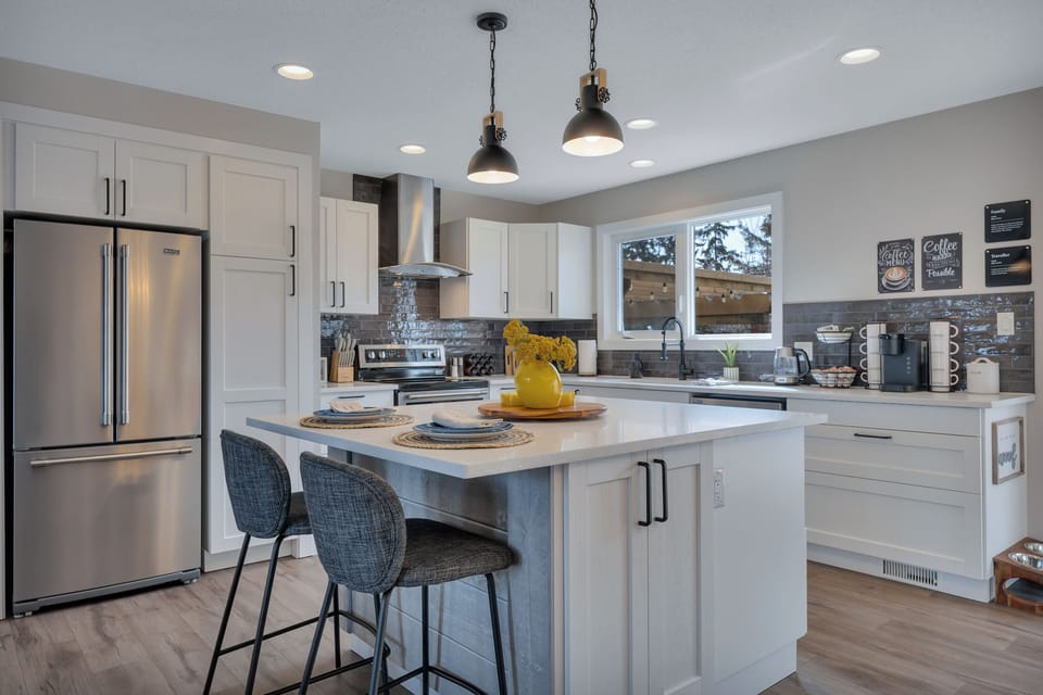 Bright modern kitchen with island seating, coffee station, and room to gather.
