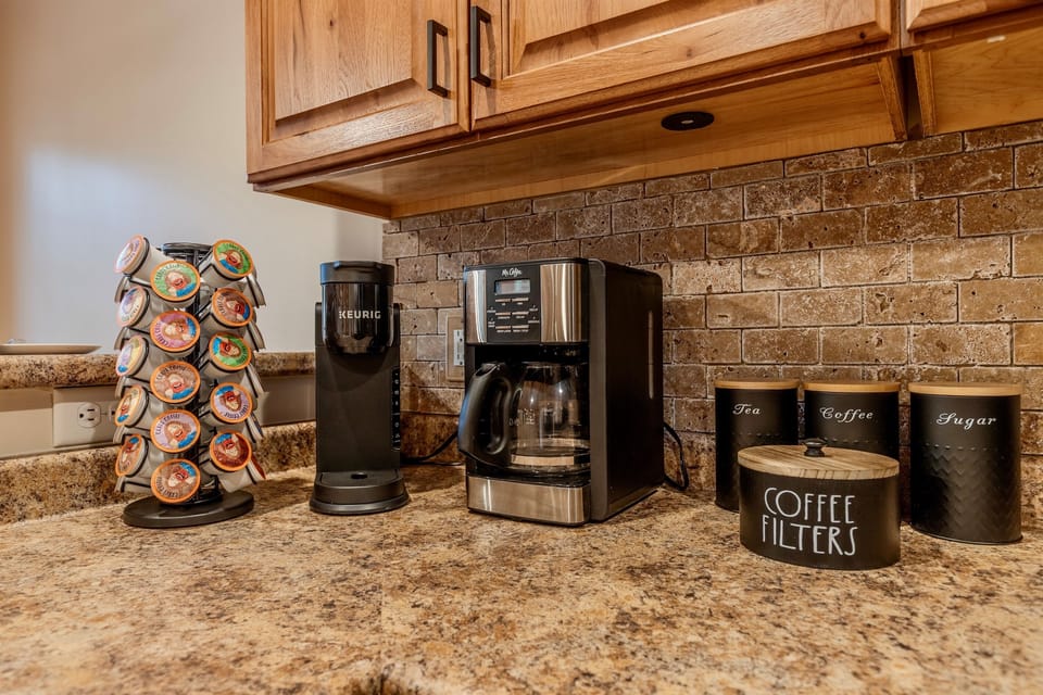 Kitchen equipped with all your essentials, including coffee, tea, sugar and coffee pods for those one cup coffee drinkers.