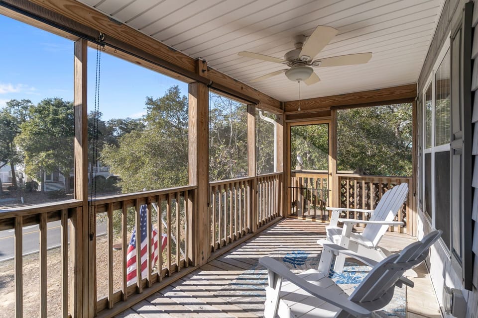 “Two screened‑in porches perfect for relaxing at the beach”