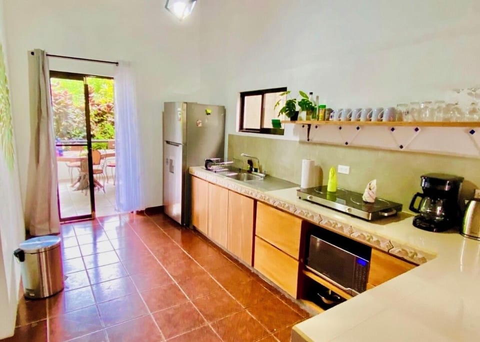 Lovely streamline kitchen. Feig to sink to cooking. Fully stocked!