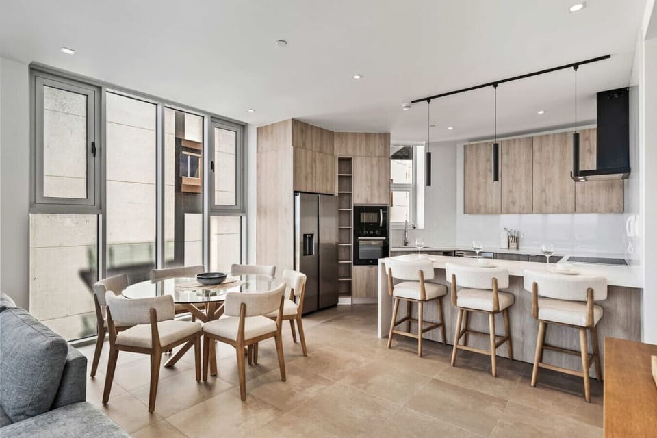 Open kitchen with dining area and island seating for shared meals