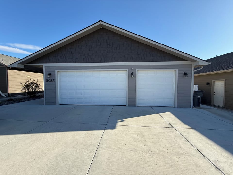 Front Garage entry is to the sidewalk on the left